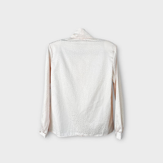 Blusa con moño “Options”