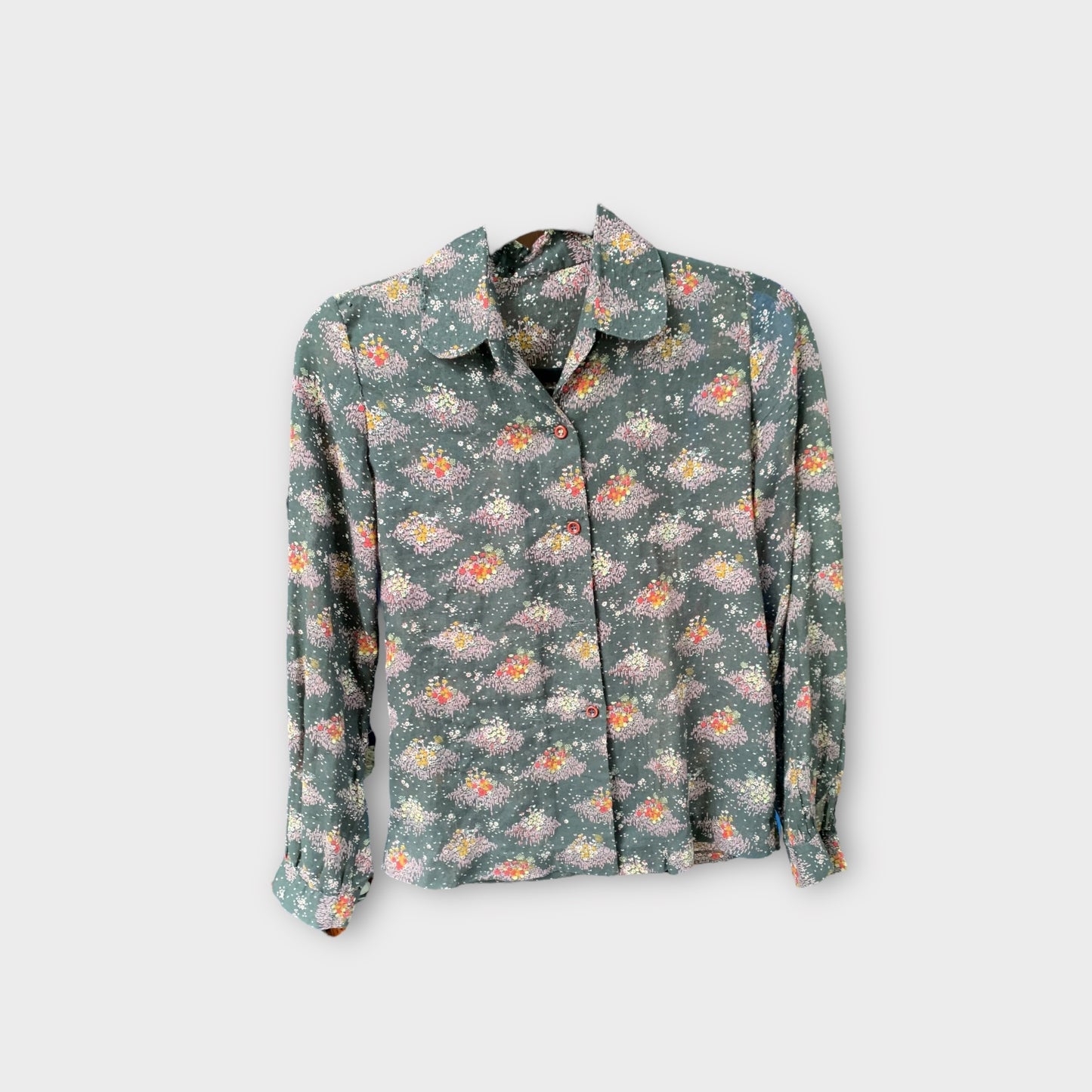 Blusa negra un poco transparente con estampado de flores pequeñas 80’s 90’s