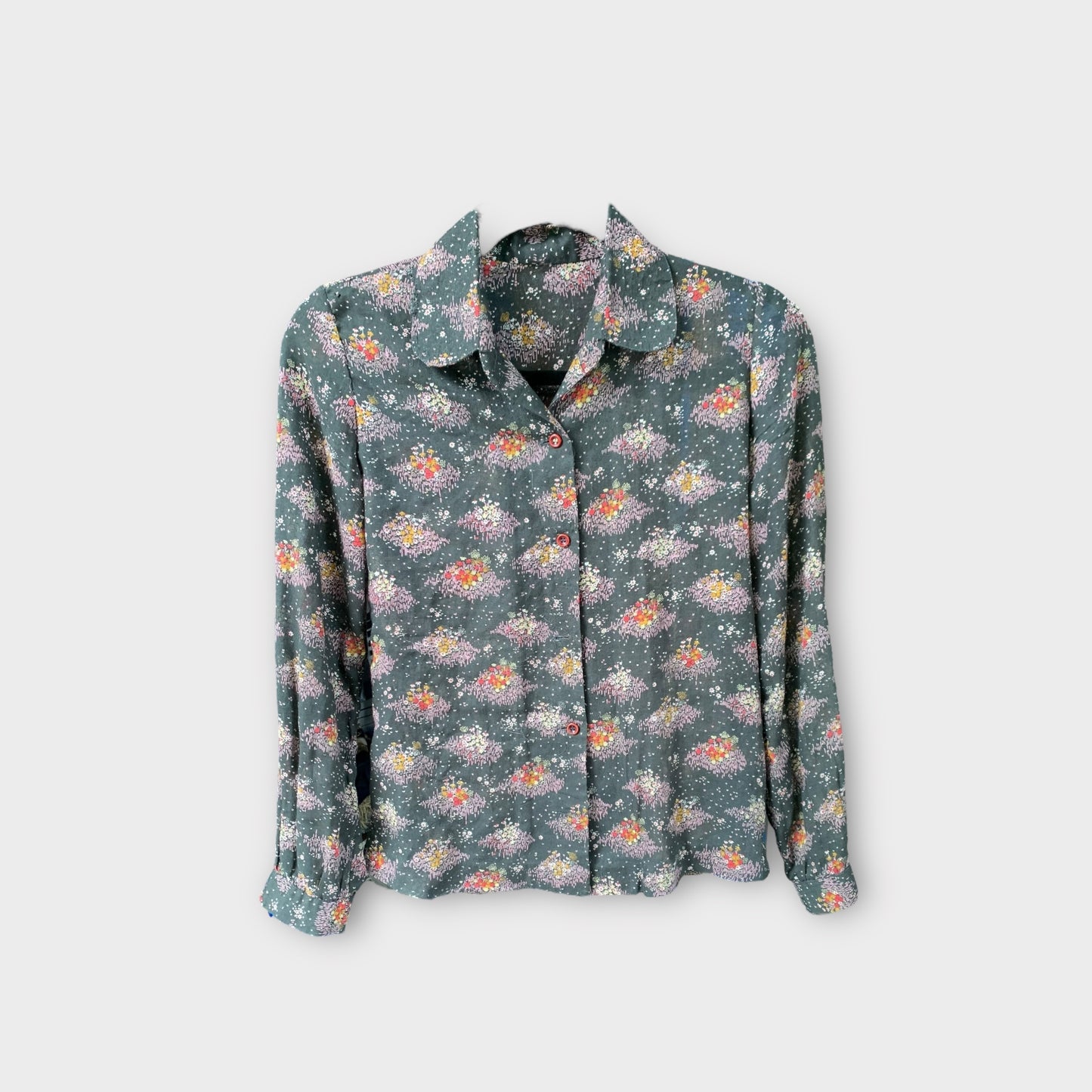 Blusa negra un poco transparente con estampado de flores pequeñas 80’s 90’s
